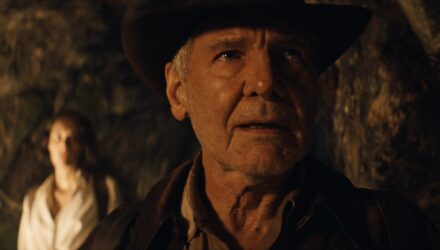 Indiana Jones walking through a cave