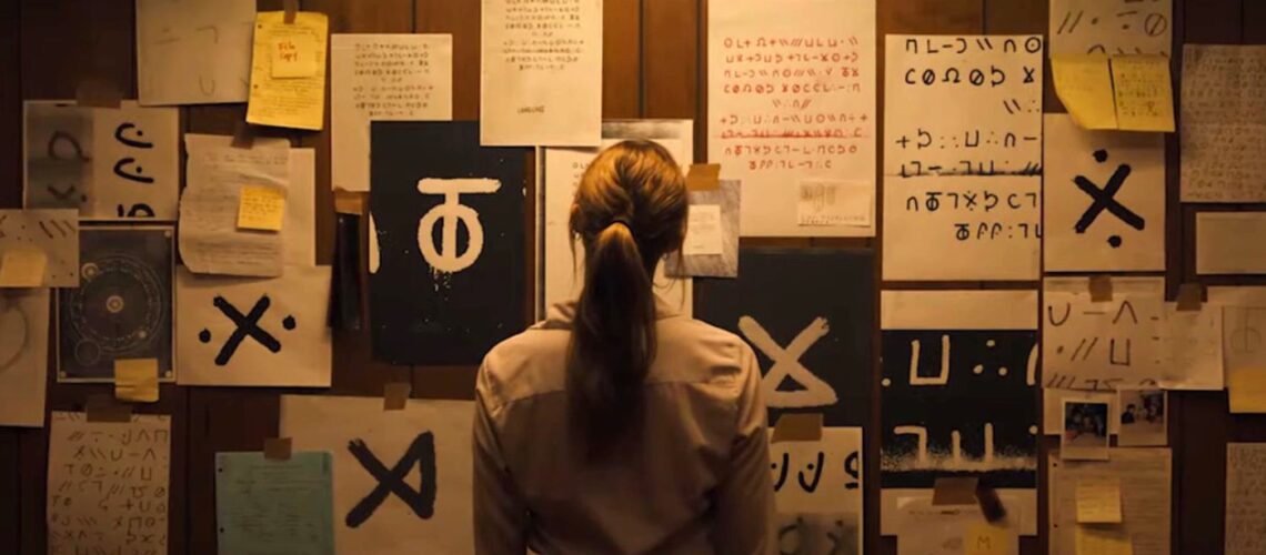 Lee Harker looks at her Zodiac-esque wall mural