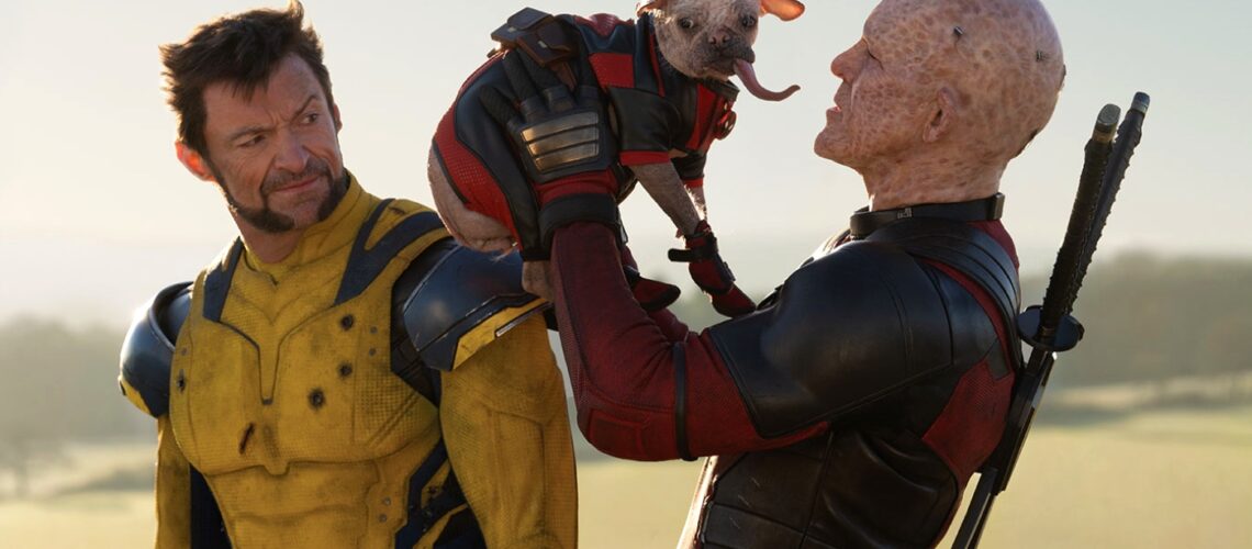 Deadpool holding his Deadpool dog while Wolverine looks on disgusted