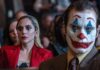 Joker and Harley Quinn sitting in court