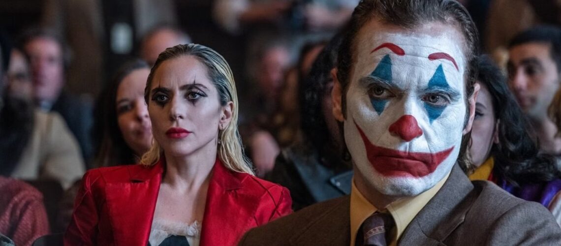 Joker and Harley Quinn sitting in court