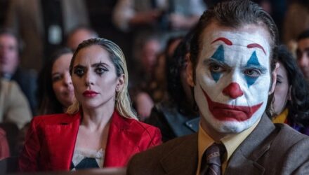 Joker and Harley Quinn sitting in court