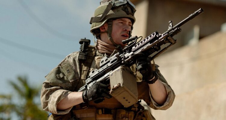 Warfare movie still backtothepicture.net showing military soldier holding a gun