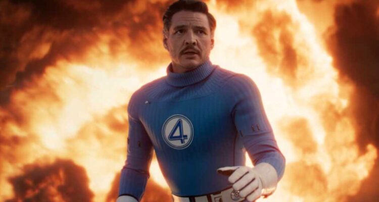 Reed Richards as Mr Fantastic standing in front of fire backtothepicture.net movie still
